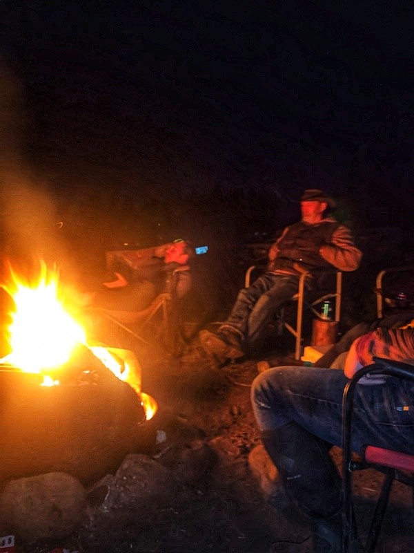 Campfire glowing after dark