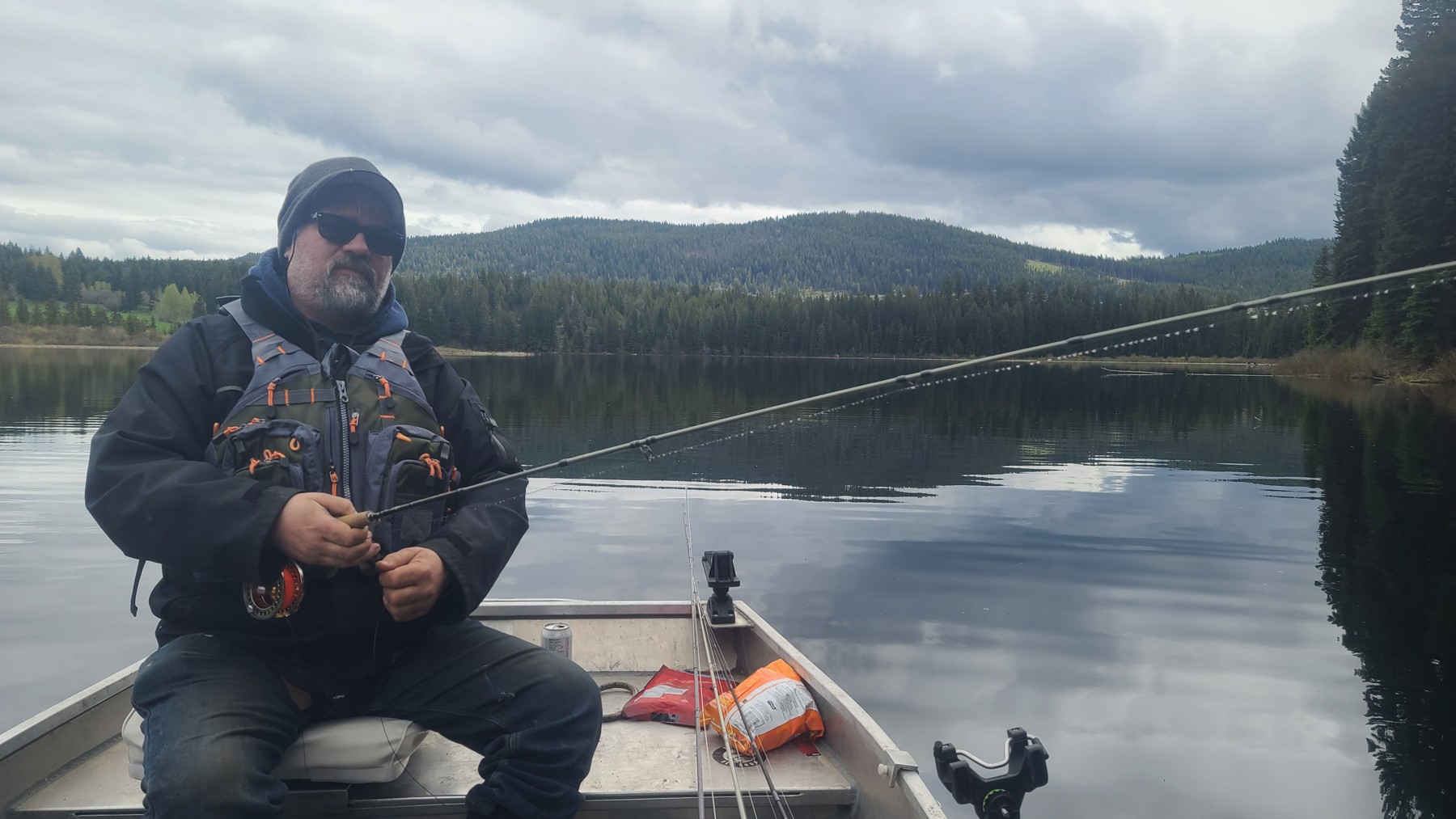 Angler managing a fly rod from the boat