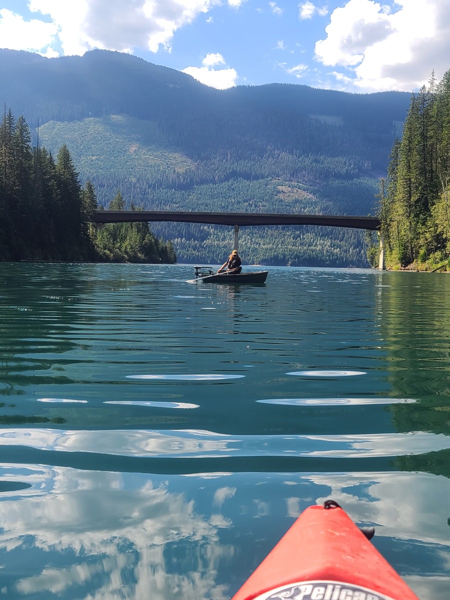 Boat moving across broad open water on the lake